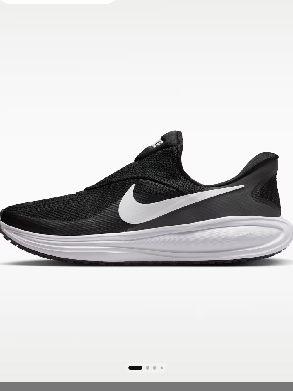 Nike NWOT Revolution 8 Easy On black slip-on sneakers with white accents, bottom